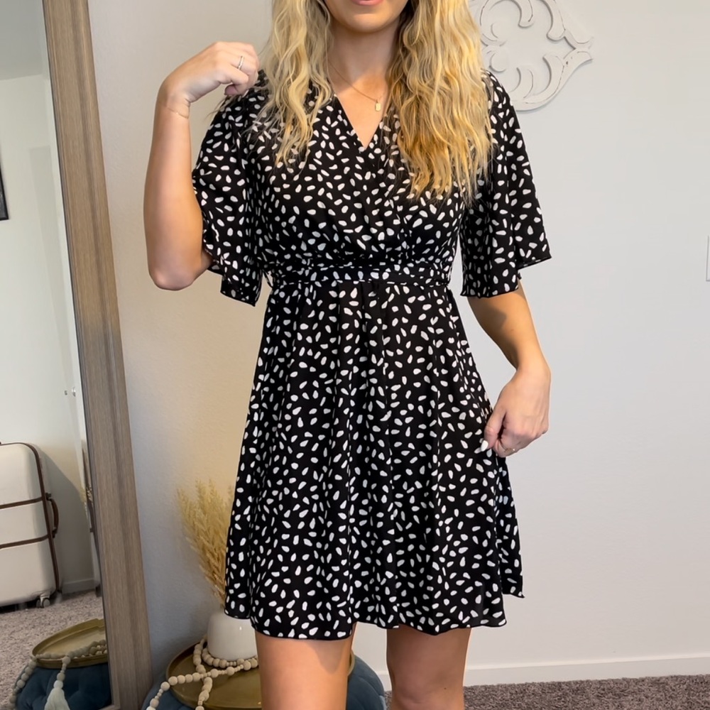 Black and white polka dot tie mini dress